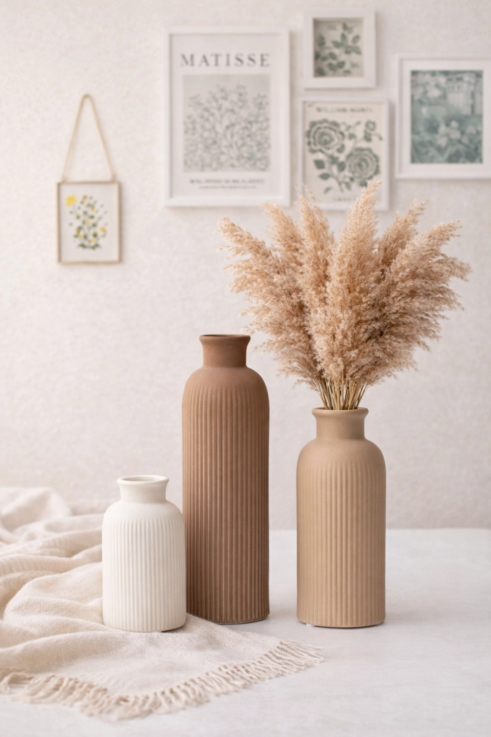 Aesthetic home decor gift ideas with ceramic vases, pampas grass and neutral wall art